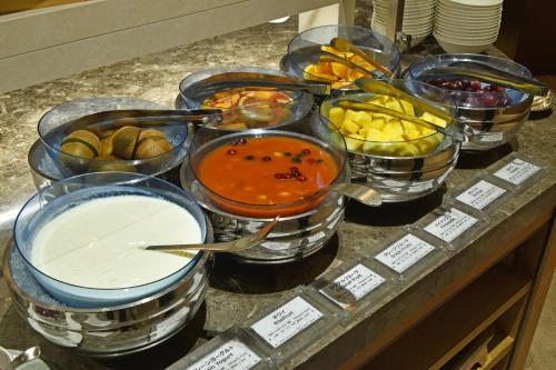 a bunch of different types of food on a counter at Hotel Okura Fukuoka in Fukuoka