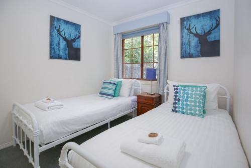 Säng eller sängar i ett rum på Amber Cottage