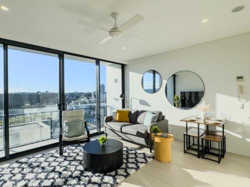 a living room with a couch and a table at Apartment in South Brisbane in Brisbane