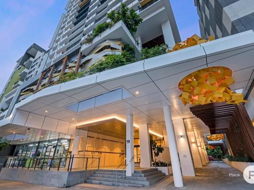 a large building with stairs in front of it at Apartment in South Brisbane in Brisbane