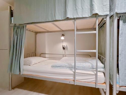 Ένα ή περισσότερα κρεβάτια σε δωμάτιο στο Fun Coliving - Monthly