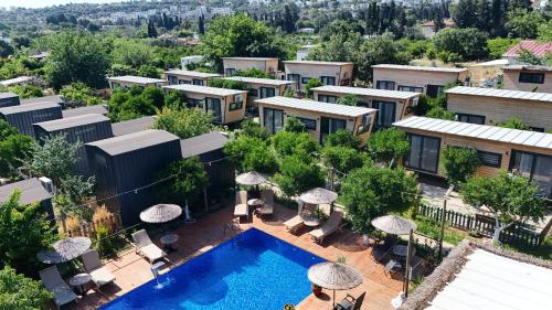 an aerial view of a resort with a swimming pool at Gaia Tiny Houses Butik Hotel in Bodrum City