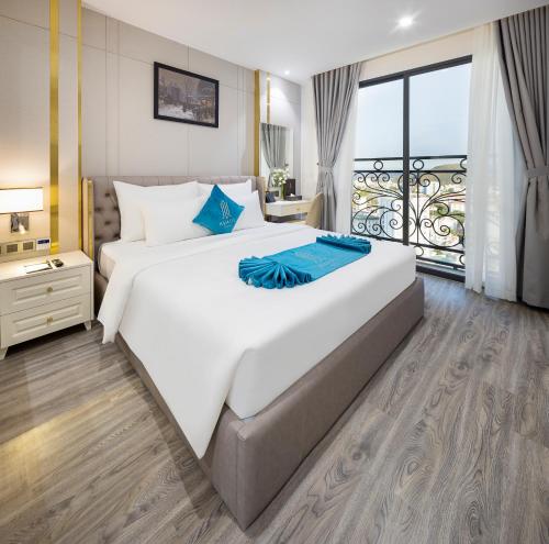 Postel nebo postele na pokoji v ubytování Avari Hotel