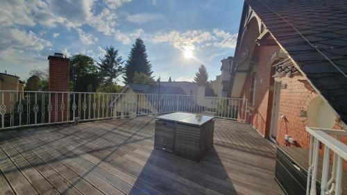 a large deck with a fence and a building at Klinkerhaus Treuen in Treuen