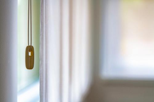 a close up of a door with a wooden door knob at Anchor Apartman by HelloBalatonlelle in Balatonlelle