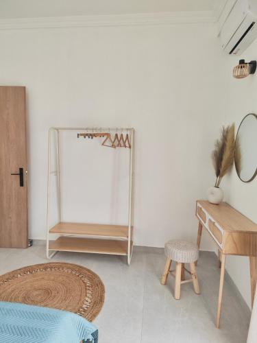 a room with a mirror and a table and a desk at Noelia House Ammouliani in Ammouliani