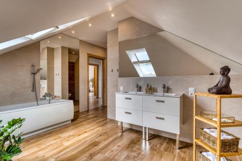 a bathroom with two sinks and a large mirror at La Nostra Villa in Zator