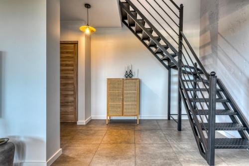 a staircase in a home with white walls and tile floors at La Nostra Villa in Zator