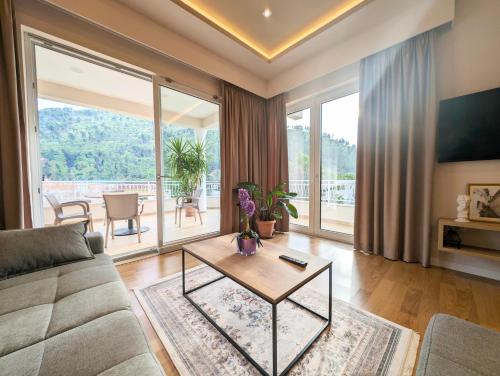 a living room with a couch and a table at Villa with Garden and Veranda in Berat