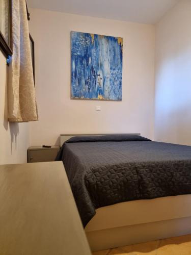 Ένα ή περισσότερα κρεβάτια σε δωμάτιο στο Studio Αυξώ Afxo