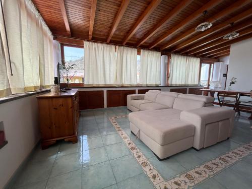 a living room with a couch and a table at Casa Luna in Lipari