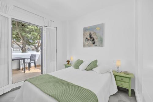 Ένα ή περισσότερα κρεβάτια σε δωμάτιο στο Apartamento El Ancla