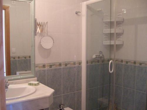 a bathroom with a shower and a sink at Apartamento en A revolta in Sanxenxo