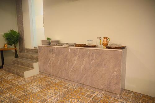 a counter in a room with some food on it at Hotel Dusk and Dawn in Rāmeswaram