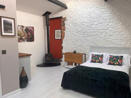 Postel nebo postele na pokoji v ubytování Linden Lodge