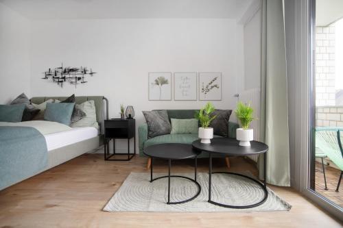 a living room with a couch and a table at Relax Apart Bonn in Bonn