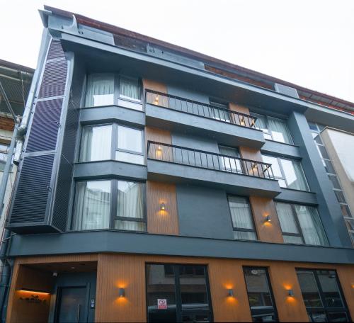 a black building with windows and a balcony at Verula City Suites in Trabzon