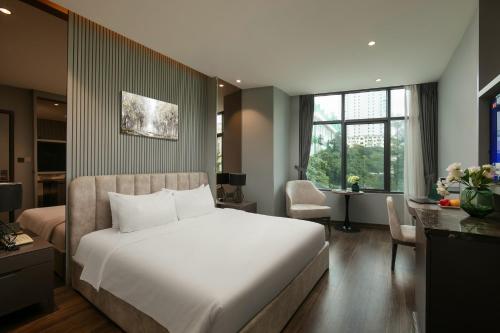 Postel nebo postele na pokoji v ubytování Ping Hotel