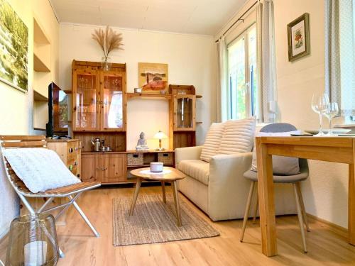 a living room with a couch and a table at Haus am See mit Kamin in Mecklenburg in Cammin