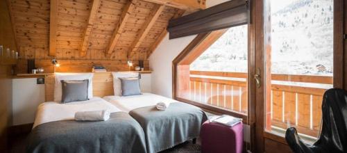 Katil atau katil-katil dalam bilik di Impala Lodge - Chalet somptueux
