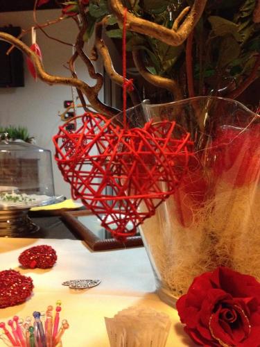 a red heart in a vase with a plant at Relais Villa Annamaria Bed end Breakfast in Istrana