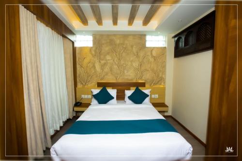 Katil atau katil-katil dalam bilik di Maya Boutique Hotel