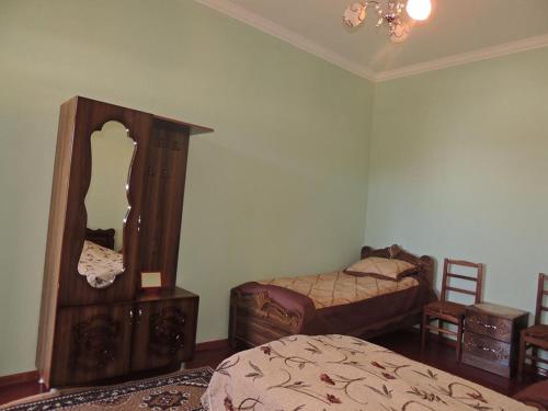 A bed or beds in a room at Mila Guest House