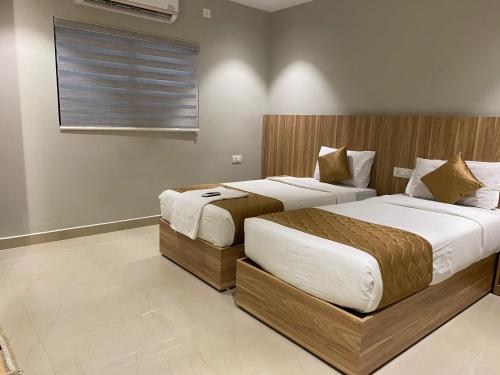 Katil atau katil-katil dalam bilik di Muziris Manor Residency