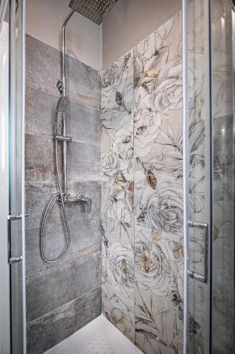 a shower with a mural of flowers on the wall at La Corte di Ripoli in Bagno a Ripoli