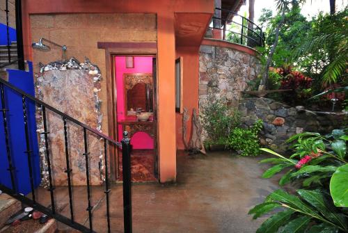 a hallway of a house with a pink door at Hotel Casa San Pancho in San Francisco