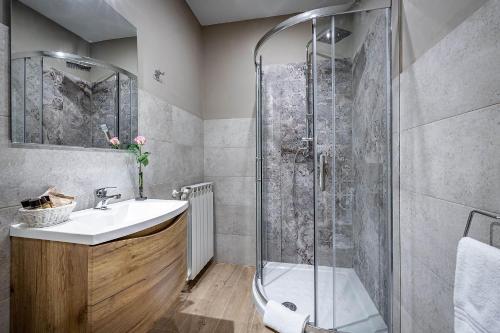 a bathroom with a shower and a sink at La Corte di Ripoli in Bagno a Ripoli