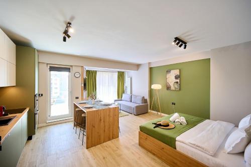 a bedroom with a bed and a desk in a room at Soleil Anne std - Infinity Pool & Spa Resort in Mamaia