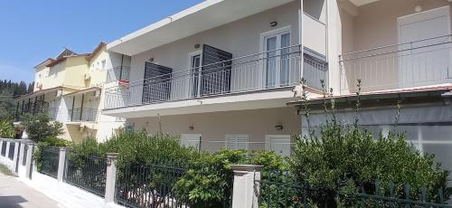 a building with balconies on the side of it at Hermes in Kavos