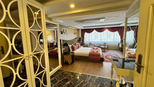 a bedroom with a bed and a living room at Burj Al Istanbul in Istanbul