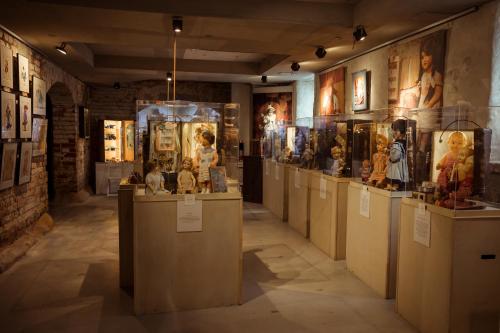 a museum with a bunch of artifacts on display at Art Hotel Roma in Liepāja