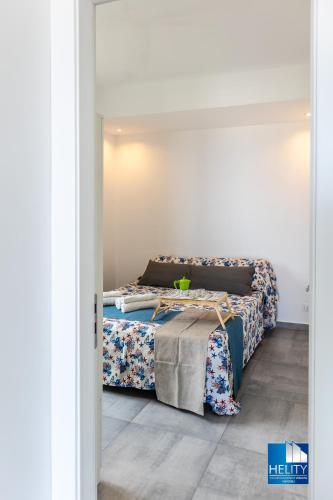 a bedroom with a bed with a table in it at CALALUNGA PIETRAGRANDE - Exclusive Shoreline Haven in Montepaone Lido