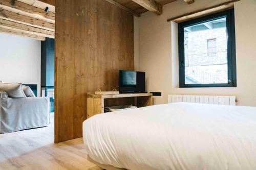 Postel nebo postele na pokoji v ubytování Cal Rus Apartament 3