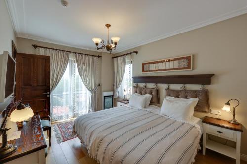 Postel nebo postele na pokoji v ubytování Akanthus Hotel Ephesus