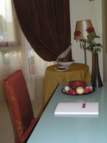 a table with a plate of food on top of it at Relais Villa Annamaria Bed end Breakfast in Istrana