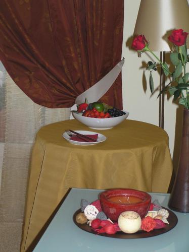 a table with a plate of food and a bowl of fruit at Relais Villa Annamaria Bed end Breakfast in Istrana