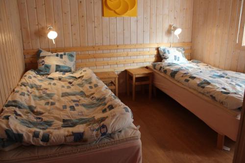 Postel nebo postele na pokoji v ubytování Lilla Sandereds Gård