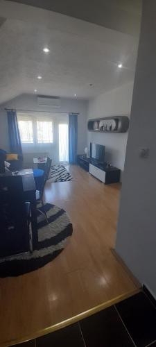 a living room with a couch and a table at Stan na dan -Bratunac- in Bratunac