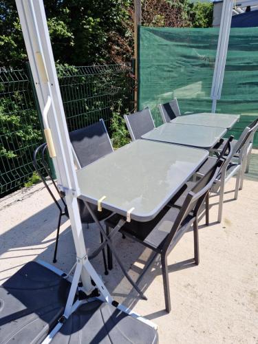 a table and chairs sitting next to each other at Chez Gabrielle in Gaillard