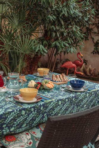 a table with bowls and plates of food on it at B&B La Corte in Chioggia