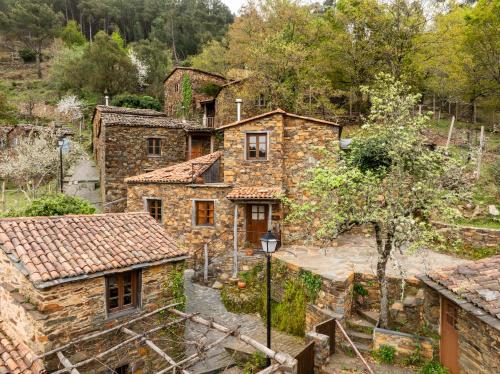 an aerial view of a stone house at Cerdeira - Home for Creativity in Lousã