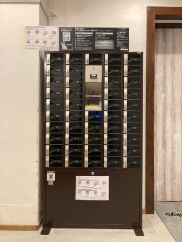 a display case filled with lots of data at Hostel Lodging Tokyo Ueno in Tokyo
