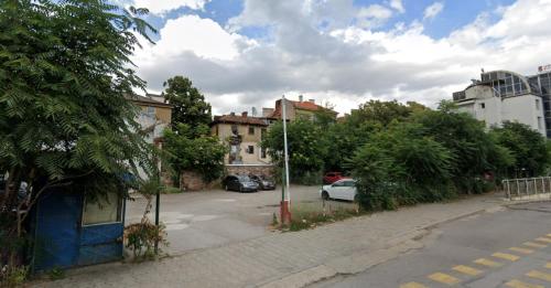 a street with cars parked in a parking lot at Urban Eden - LUX & STYLE, 2-Bedroom, 2-Bathroom in Sofia