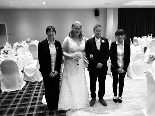 a bride and groom walking down the aisle in a wedding at Percy French Hotel in Strokestown