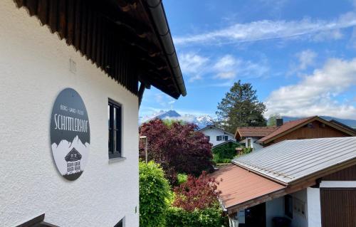 a sign on the side of a building at Schittlerhof in Fischen