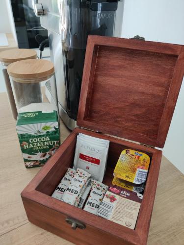 a wooden box with various items in it on a table at Kuća za odmor Villa Cesarica - Zagreb in Graberje Ivanićko